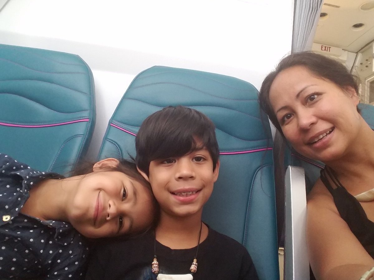 Jaden with family on airplane