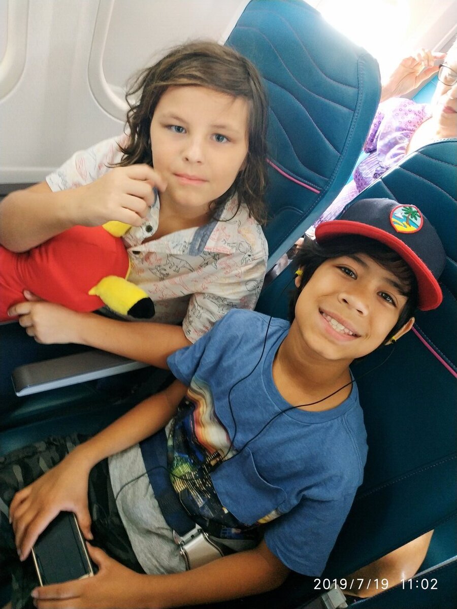 Jaden and friend on airplane