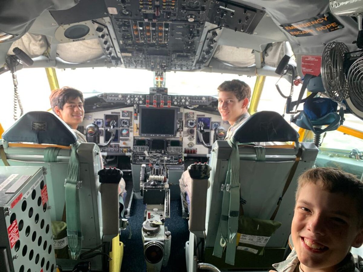 Jaden in large aircraft cockpit smiling